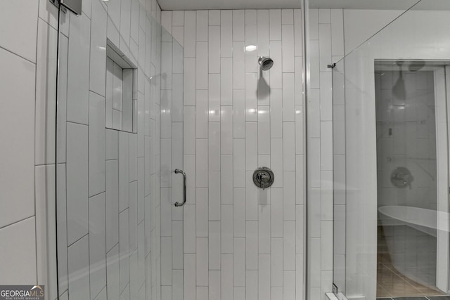 bathroom featuring an enclosed shower