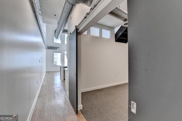 corridor featuring light hardwood / wood-style floors