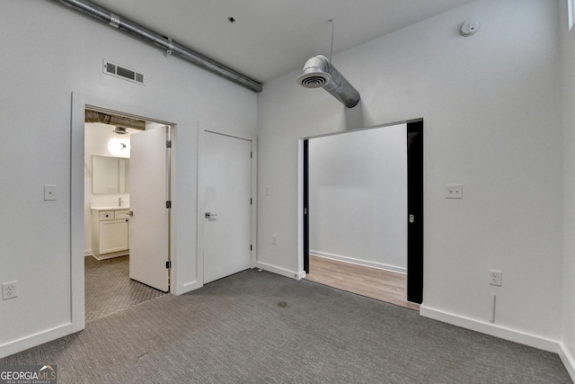 unfurnished bedroom featuring carpet and ceiling fan