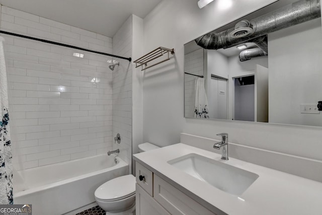 full bathroom with vanity, shower / bath combo, and toilet