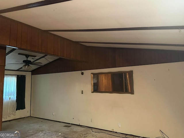 spare room with ceiling fan and vaulted ceiling