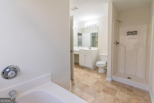 bathroom featuring a shower, vanity, and toilet