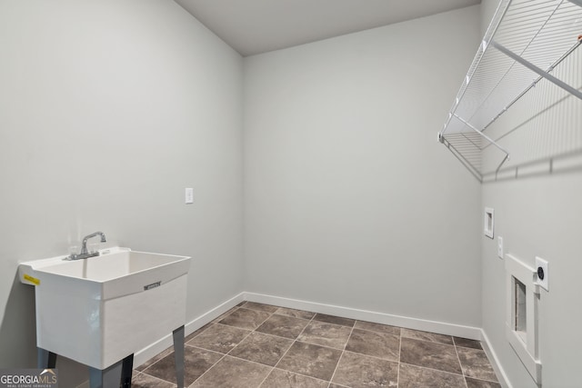 laundry room featuring washer hookup, laundry area, a sink, and baseboards