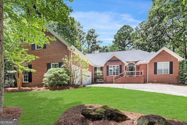 view of front of home with a garage and a front yard