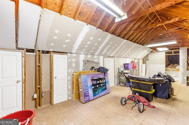 playroom featuring lofted ceiling