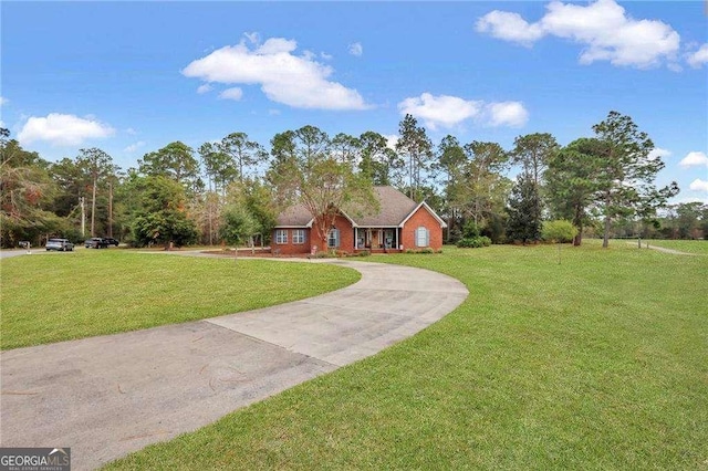 single story home with a front lawn