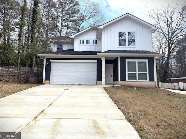 view of front facade with a garage and a front yard