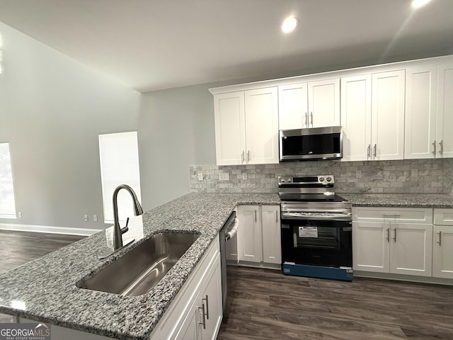 kitchen featuring white cabinetry, appliances with stainless steel finishes, sink, and dark wood-type flooring