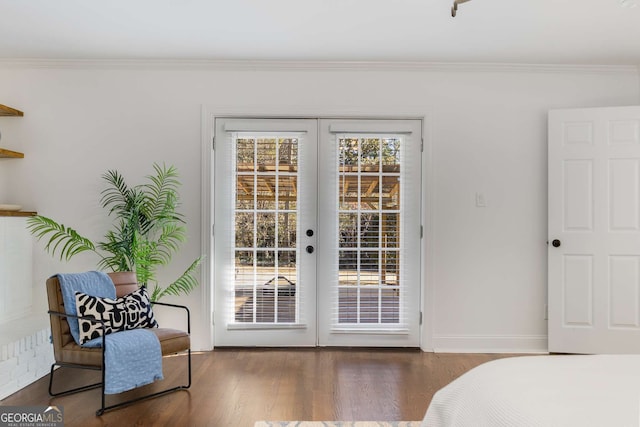 doorway featuring french doors, ornamental molding, and dark hardwood / wood-style floors