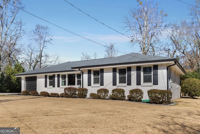 ranch-style home featuring a front yard