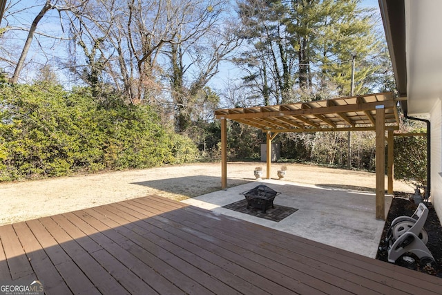 deck featuring a pergola and a fire pit