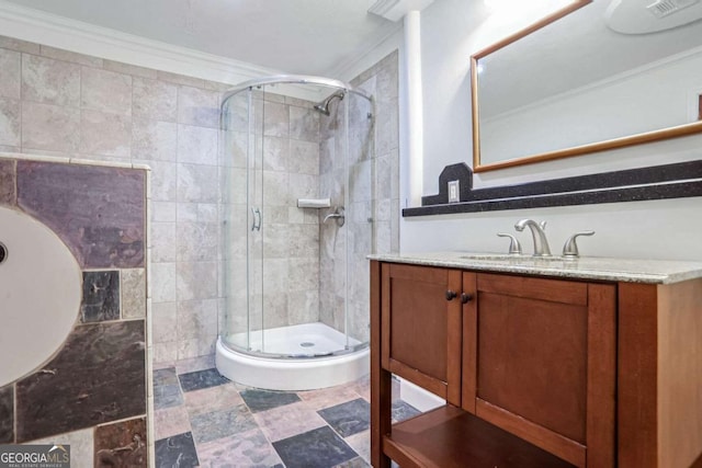 bathroom with ornamental molding, an enclosed shower, and vanity