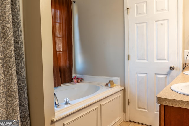 full bath with a bath and vanity