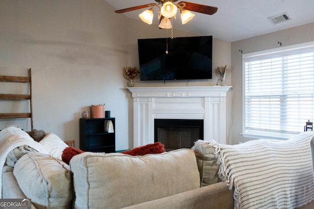 living room featuring lofted ceiling and ceiling fan