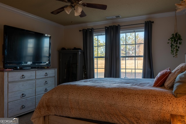 bedroom featuring ornamental molding and ceiling fan