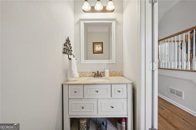 bathroom featuring hardwood / wood-style flooring and vanity