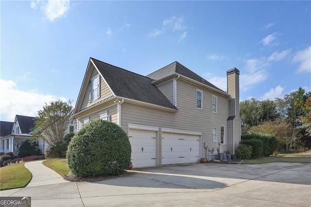 view of property exterior with a garage and central air condition unit