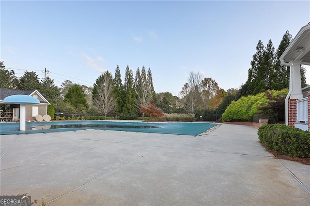 view of pool featuring an outdoor structure and a patio area