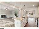 kitchen with sink, a center island, and white cabinets