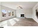 unfurnished living room with an inviting chandelier