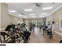 exercise room featuring ornamental molding