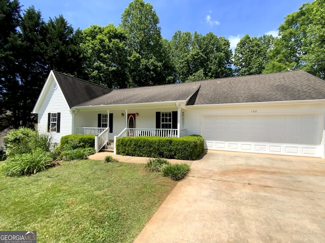 single story home featuring a garage, a front yard, and a porch