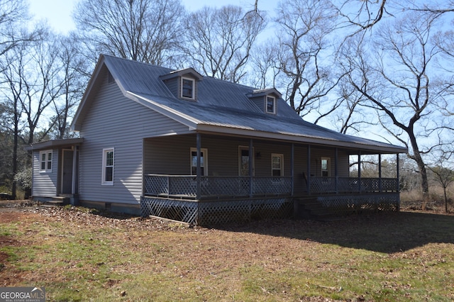 view of front facade with covered porch and a front lawn