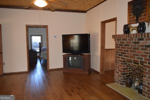 unfurnished living room with wooden walls, hardwood / wood-style flooring, ceiling fan, wooden ceiling, and beam ceiling