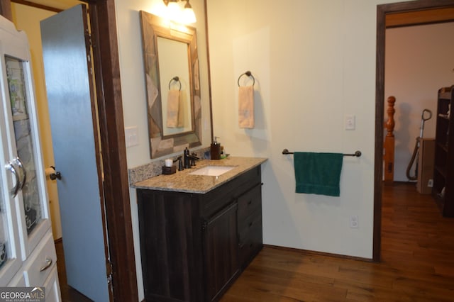 bathroom with vanity and wood-type flooring