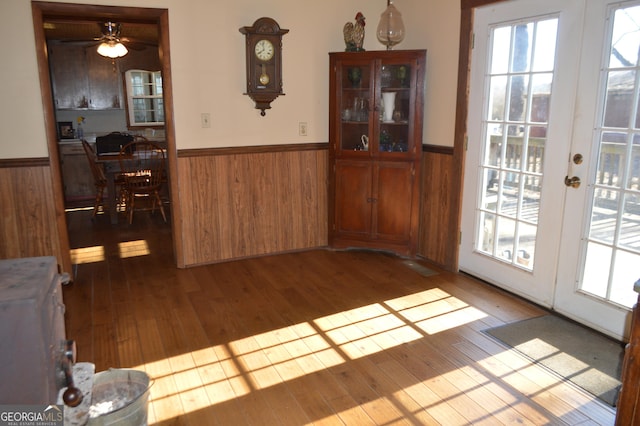 dining space featuring french doors and wood-type flooring