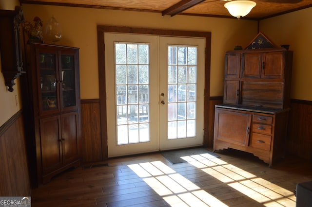 doorway to outside with beam ceiling, light hardwood / wood-style floors, and french doors