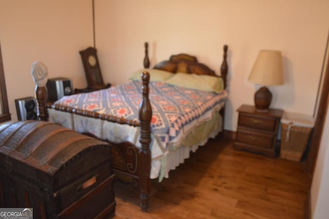 bedroom with wood-type flooring