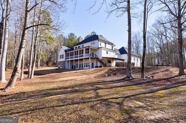 3055 Spring Hill Dr, Monroe, GA 30656 - back of property featuring a deck and a chimney
