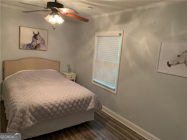 bedroom with ceiling fan, ornamental molding, and dark hardwood / wood-style flooring