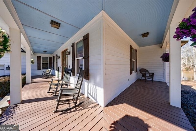 wooden terrace featuring a porch