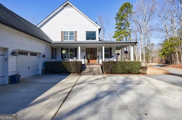 3055 Spring Hill Dr, Monroe, GA 30656 - view of front of home with a porch, concrete driveway, and an attached garage