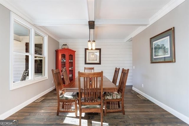 dining area with beam ceiling, dark wood-style flooring, and baseboards