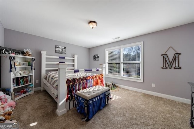 carpeted bedroom featuring visible vents and baseboards