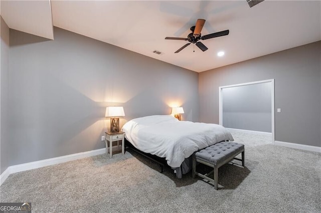 carpeted bedroom featuring baseboards, visible vents, and ceiling fan