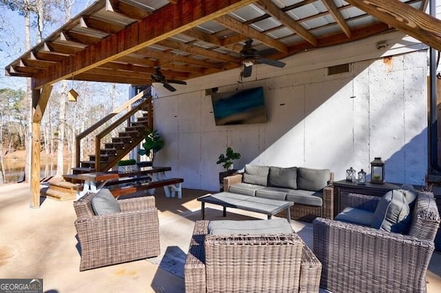 view of patio / terrace with stairs, visible vents, an outdoor living space, and a ceiling fan