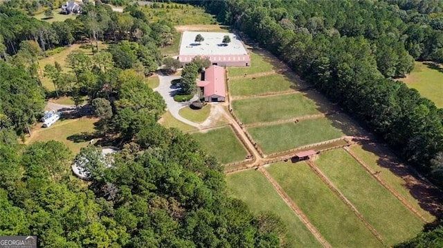 bird's eye view featuring a forest view and a rural view