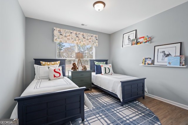 bedroom featuring dark hardwood / wood-style flooring