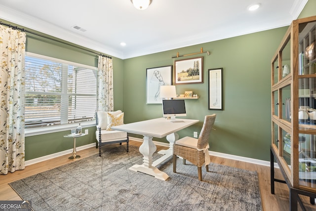 office area featuring ornamental molding and wood-type flooring