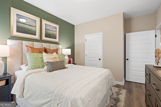 bedroom featuring dark hardwood / wood-style floors