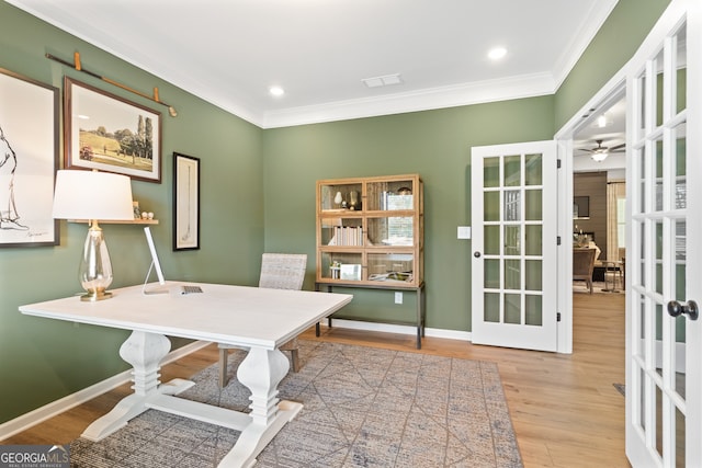 office area featuring ornamental molding, light hardwood / wood-style floors, french doors, and ceiling fan