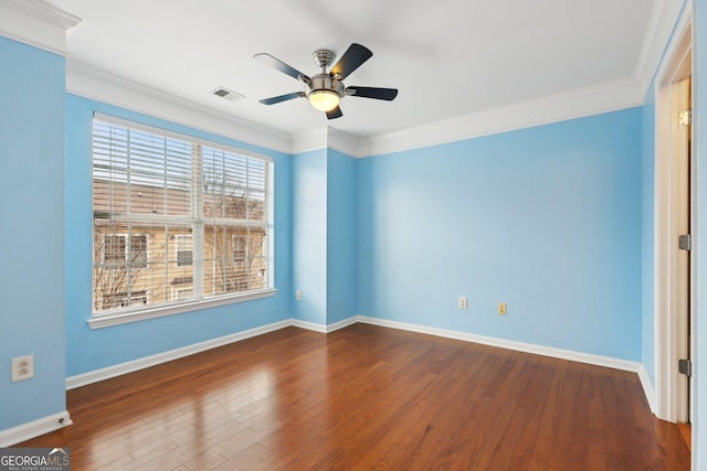 empty room featuring ornamental molding, hardwood / wood-style floors, and ceiling fan