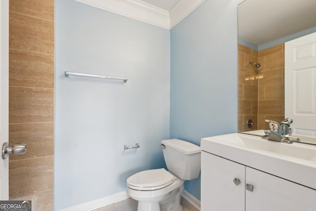 bathroom featuring tile patterned flooring, tiled shower, vanity, ornamental molding, and toilet