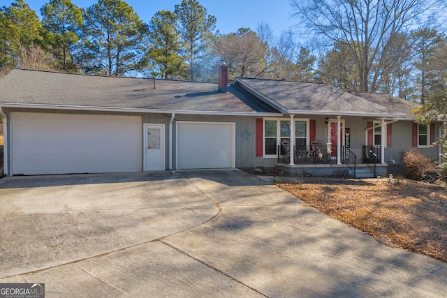 ranch-style house with a garage and covered porch