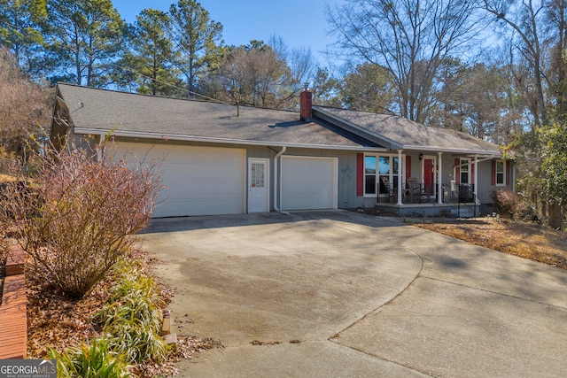 ranch-style house with a garage and a porch