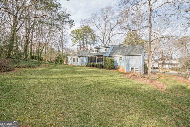 view of yard with a sunroom